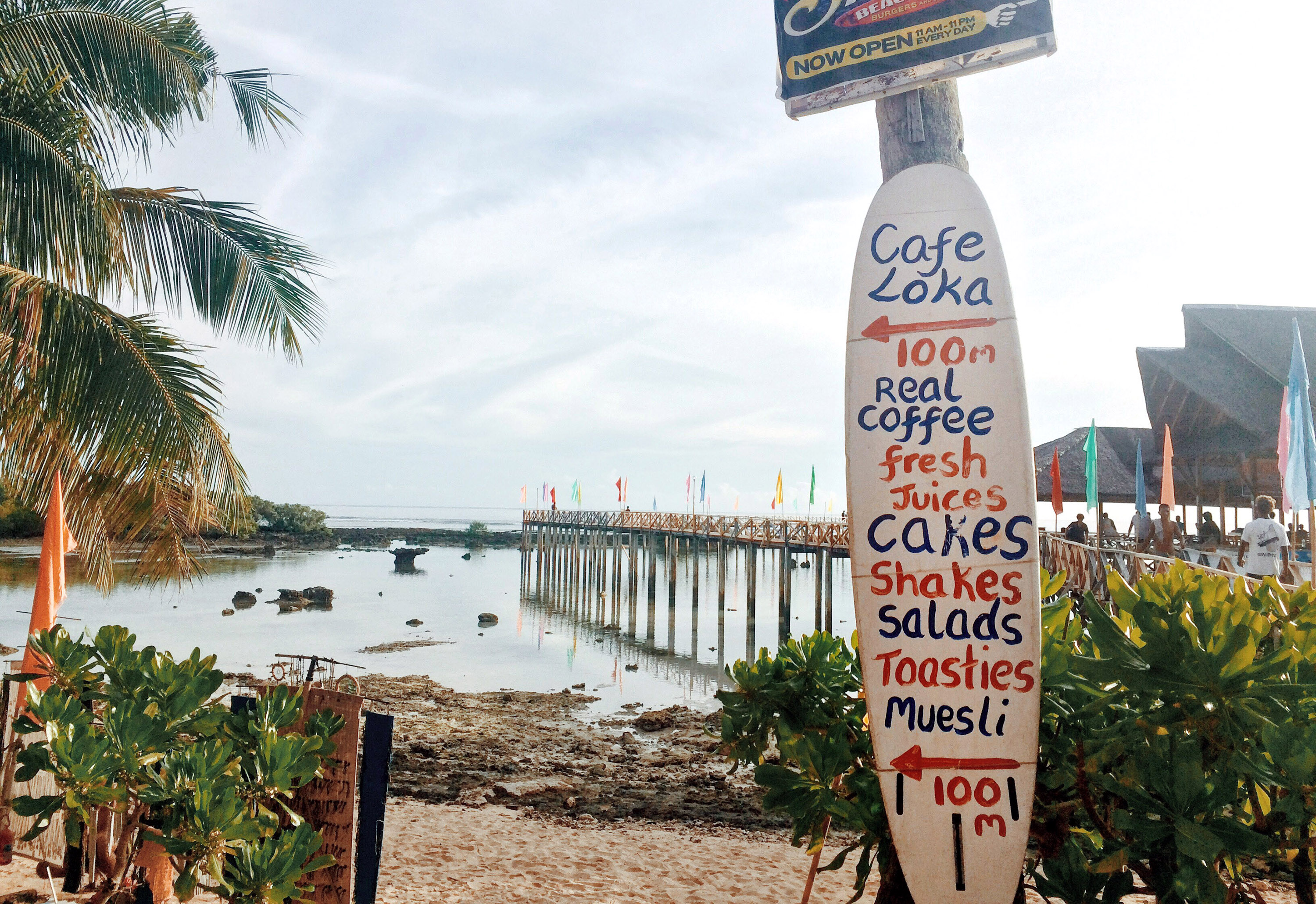 Cafe Loka surfboard signboard at Cloud 9, Siargao